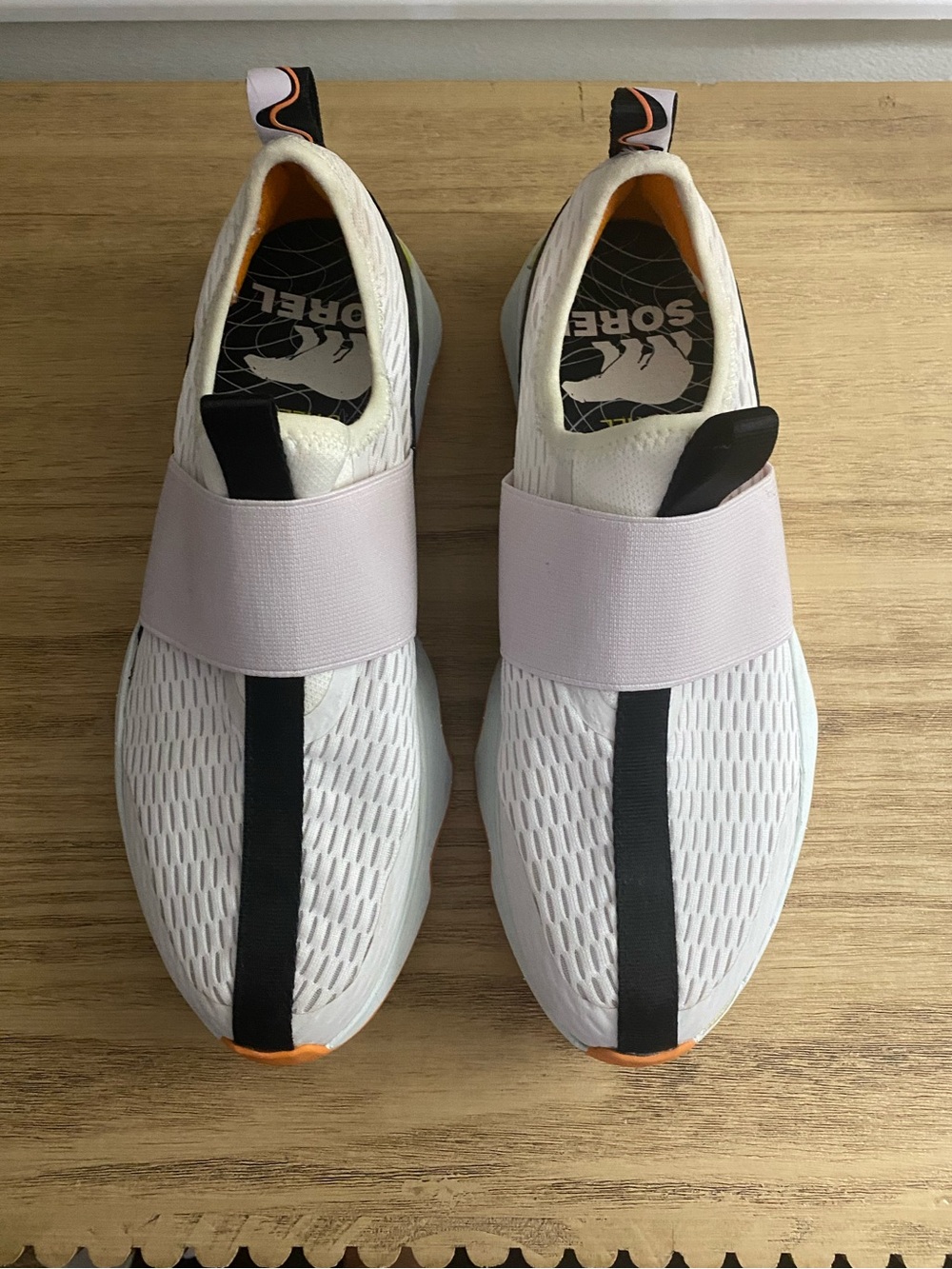 Sorel Slip-On Athletic Sneakers in White, Black and Orange